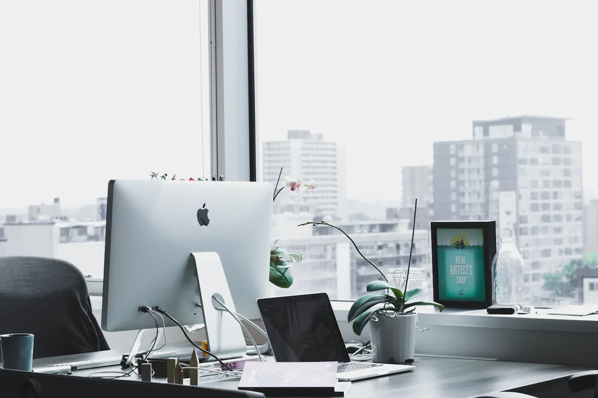 Modern workspace with laptop — representing focused consulting and systems work